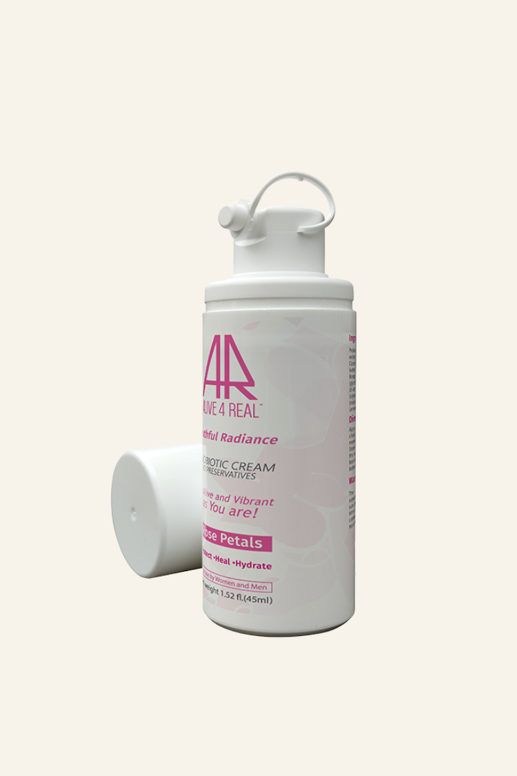 Made-to-order Alive4Real probiotic skincare cream Youthful Radiance with live Lactobacillus probiotic, fresh rose petals extract, hyaluronic acid for dry skin and anti-aging benefits.Packaged in air-free pump container for freshness.Enhances skin barrier function, restore healthy skin microbiome.Preservatives free.Shown with open cover.